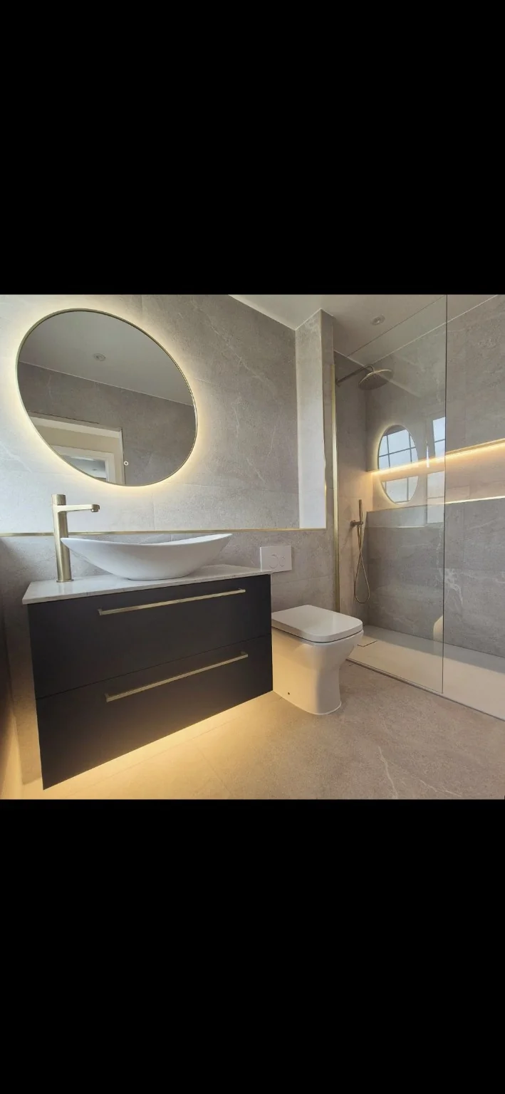 Modern bathroom with illuminated mirror