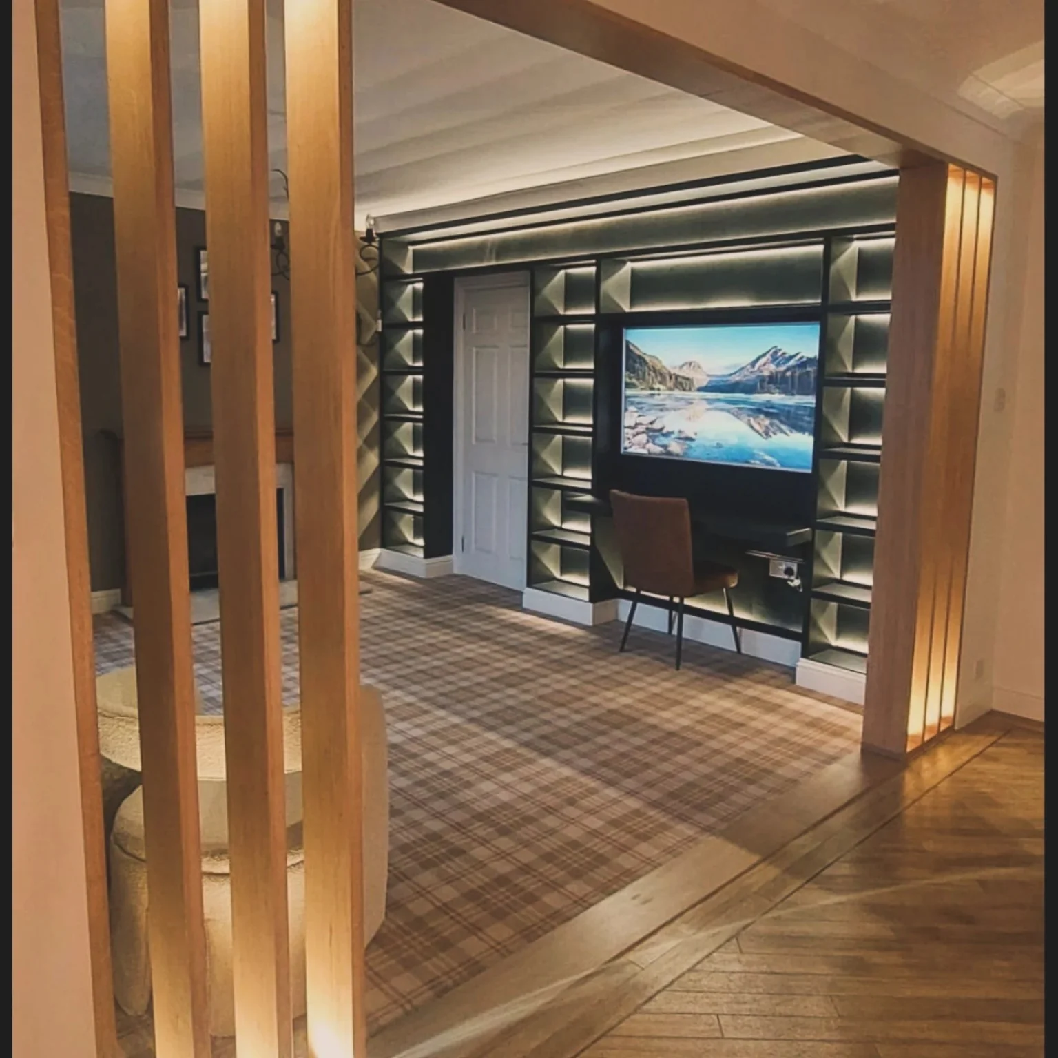 Illuminated media wall and oak slatted room divider in Callander