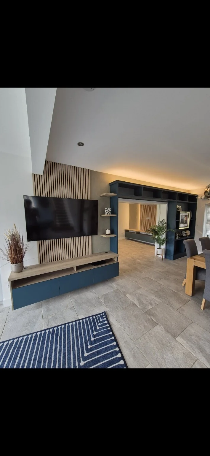 Bespoke media wall with fitted oak storage in Kinross