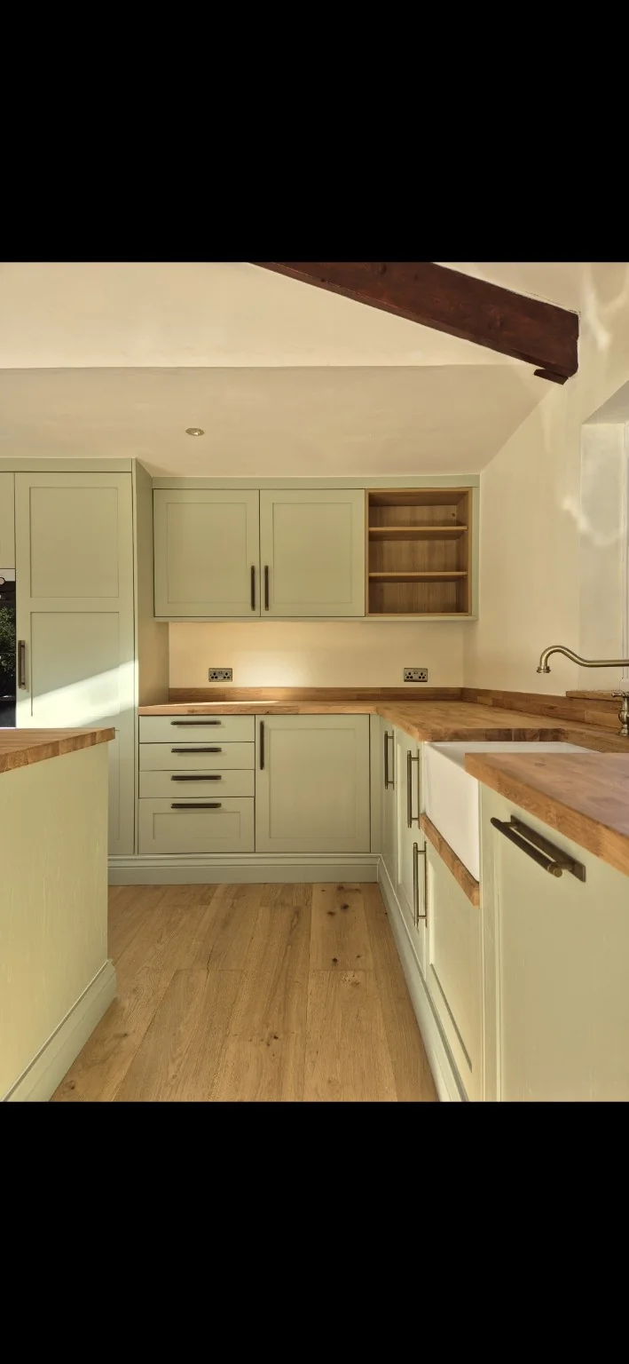 Sage green kitchen cabinetry in Stirling